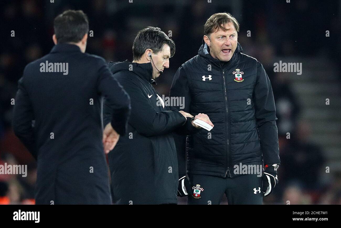 Southampton manager Ralph Hasenhuttl (right) speaks with fourth official Lee Probert about the time remaining during the Premier League match at St Mary's, Southampton. Stock Photo