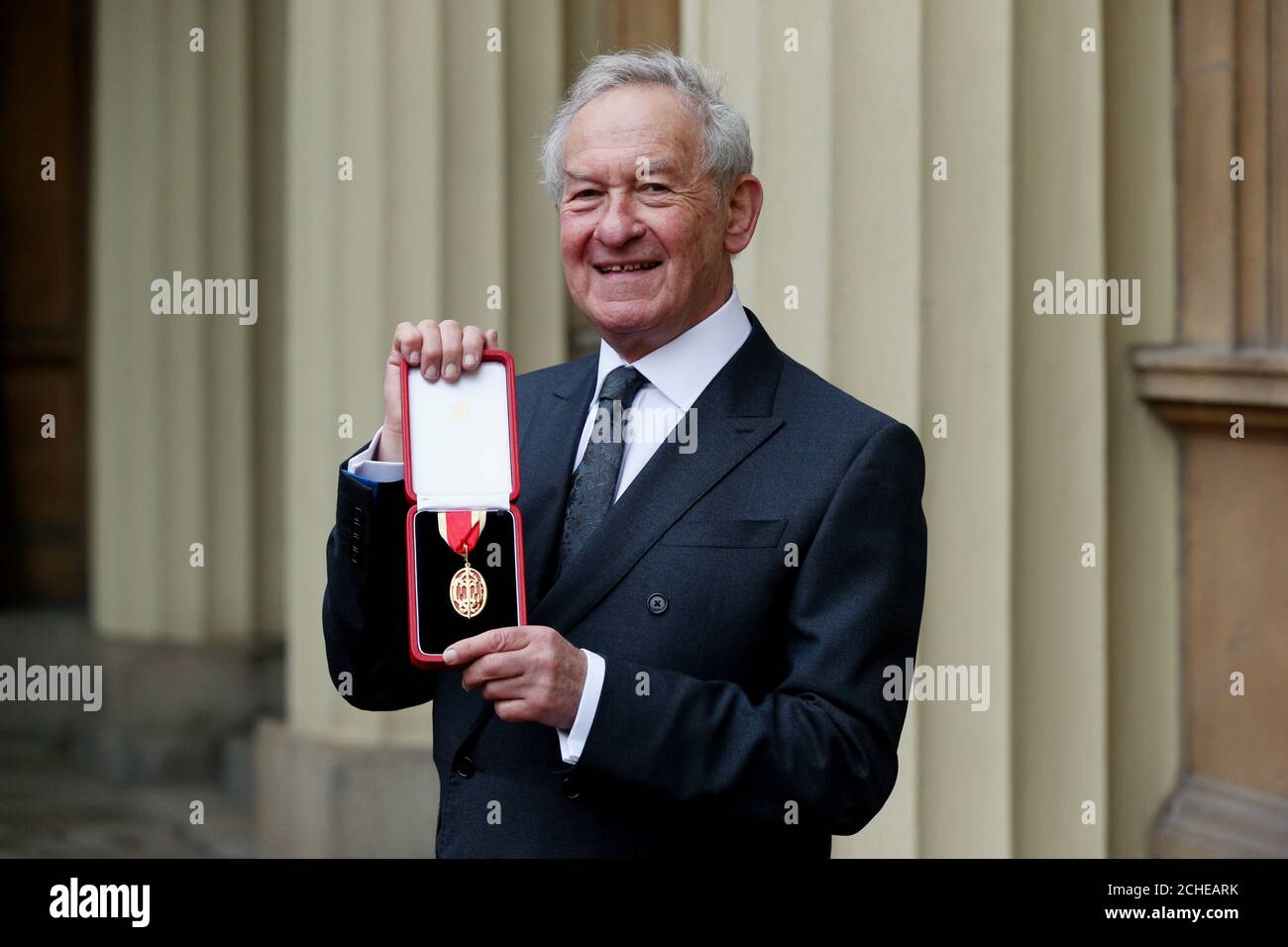 Historian and broadcaster Sir Simon Schama after he was awarded a Knighthood in an Investiture ceremony at Buckingham Palace, London. Stock Photo