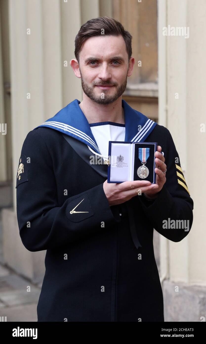 Leading Seaman Simon Wharton after he was awarded the Queen's Gallantry Medal in an Investiture ceremony at Buckingham Palace, London. Stock Photo