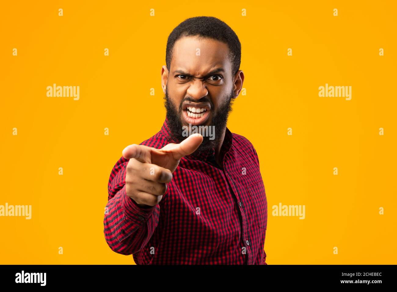 Angry black man pointing finger at camera Stock Photo - Alamy