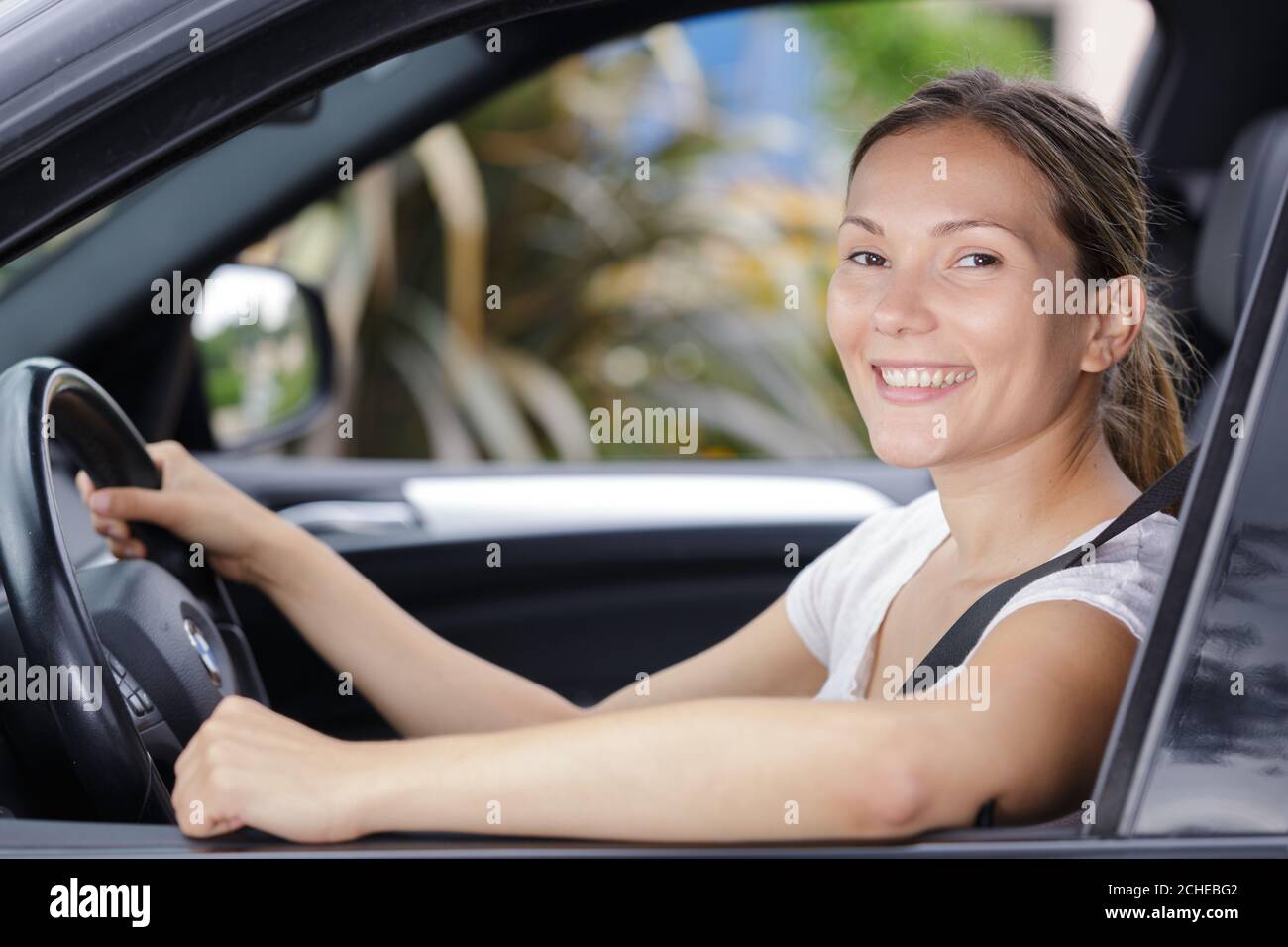 Happy woman buyer taking car hi-res stock photography and images - Alamy