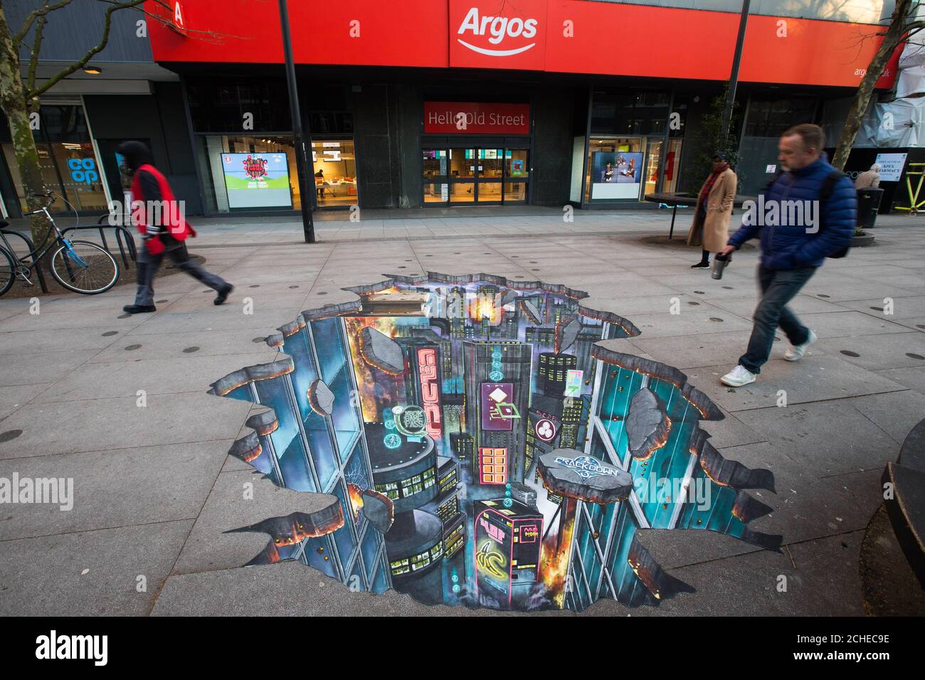 EDITORIAL USE ONLY Passers by Look At A Piece Of 3D Street Art Is EDITORIAL USE ONLY Passers by Look At A Piece Of 3D Street Art Is
