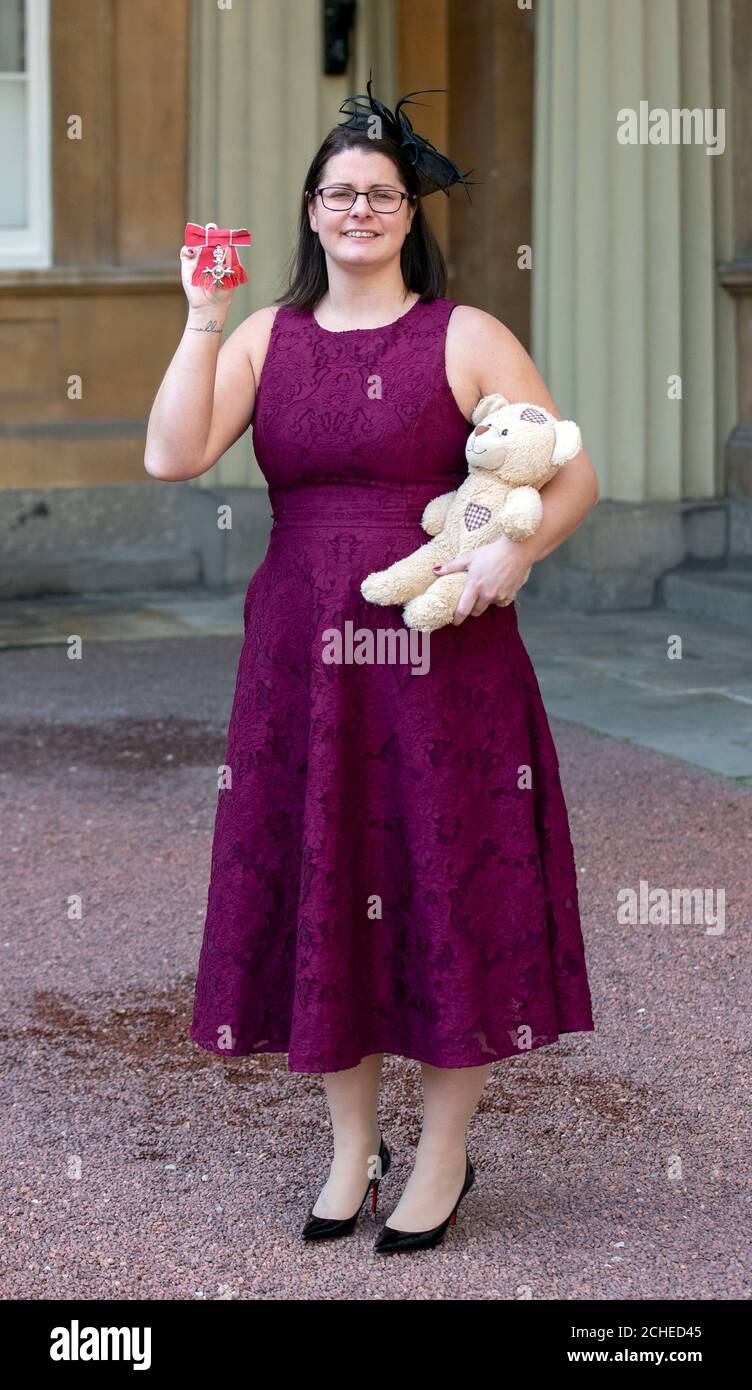 Melissa Mead with her MBE, awarded for services to to raising awareness of Sepsis, following an investiture ceremony at Buckingham Palace, London. Stock Photo