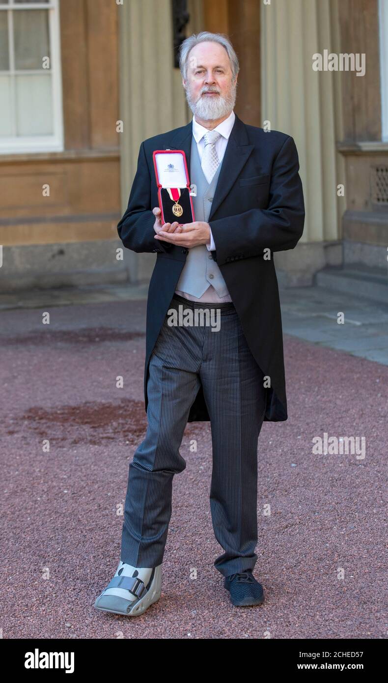 Sir Richard Alston with his knighthood, awarded for services to dance, following an investiture ceremony at Buckingham Palace, London. Stock Photo