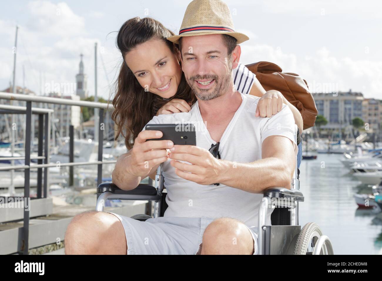 happy couple in wheelchair taking a selfie Stock Photo - Alamy
