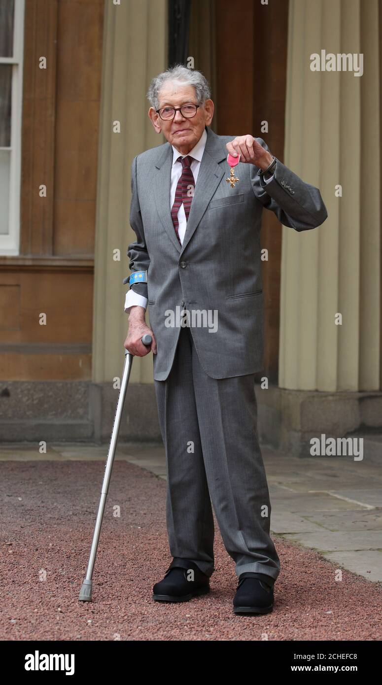 Tom Karen with his OBE following an investiture ceremony at Buckingham