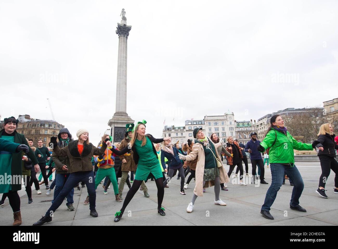 EDITORIAL USE ONLY A human shamrock formation created by over 200 participants and one dog, all wearing green, appeared in Trafalgar Square, as part of Tourism Ireland's St Patrick's Day celebrations in association with the Mayor of London's #LondonIsOpen campaign. Stock Photo