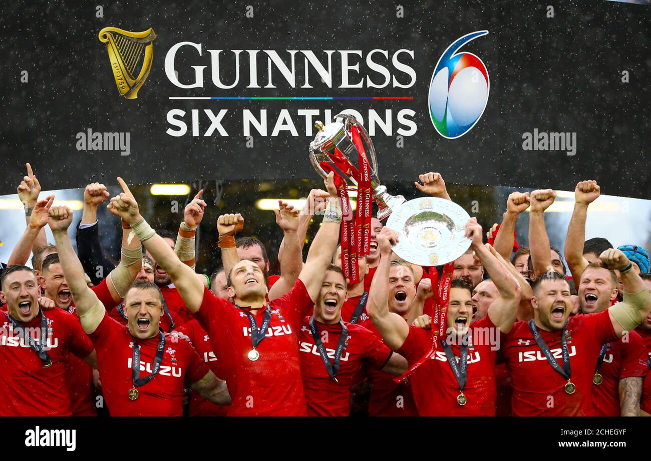 Wales lift the Six Nations Trophy and the Triple Crown trophy after the Guinness Six Nations