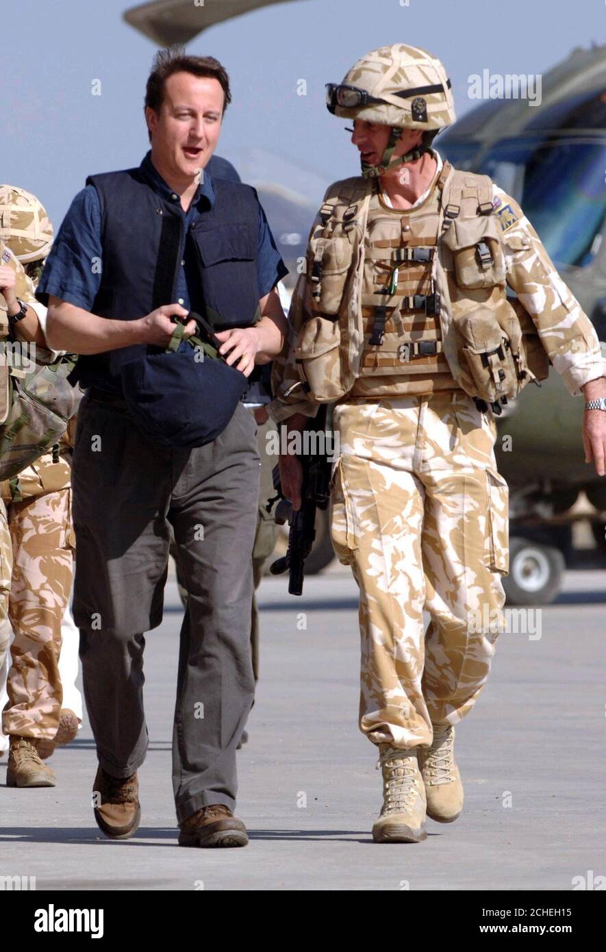 The leader of the Conservative Party David Cameron (left) prepares to board a Lynx helicopter to fly to Shaibah Logistic Base (SLB) with Lieutenant General Richard Shirreff (right) at Basrah Air Station in southern Iraq. Stock Photo