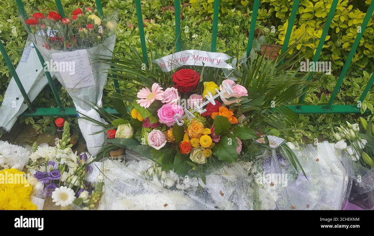 Flowers at the scene after the fatal stabbing of a man in his 20s in