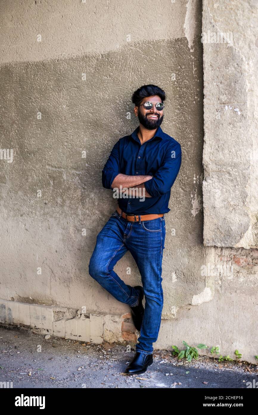Portrait of young stylish indian man model pose in street Stock Photo -  Alamy