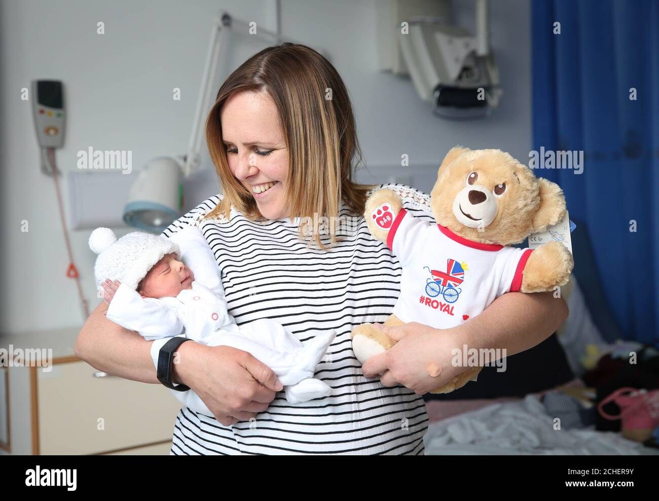 EMBARGOED TO 0001 WEDNESDAY MAY 8 EDITORIAL USE ONLY Carmen Barrett from Petersfield, with her daughter Sienna Rose and a toy bear at the Royal Surrey County Hospital in Guildford as the Build-A-Bear workshop celebrates the historic birth of the latest royal by delivering 1,000 bears to new-borns at 10 royal hospitals, infirmaries and maternity units across the UK. Stock Photo