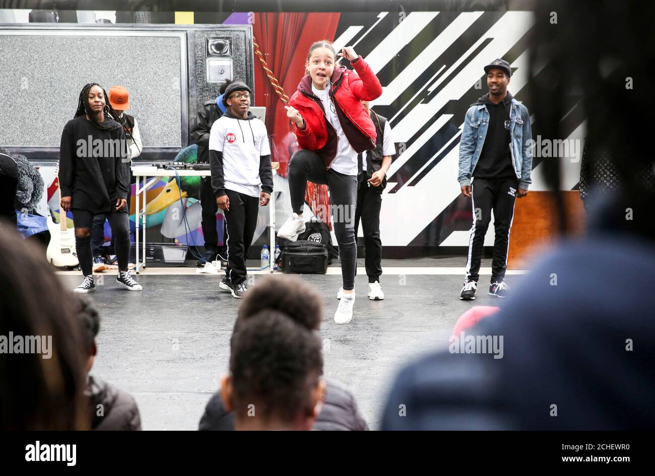 EDITORIAL USE ONLY A group of young dance enthusiasts from 'New Movementz', presented by East London Dance battle it out on the street as part of 'Your Stratford Stage' in the International Quarter London. Stock Photo