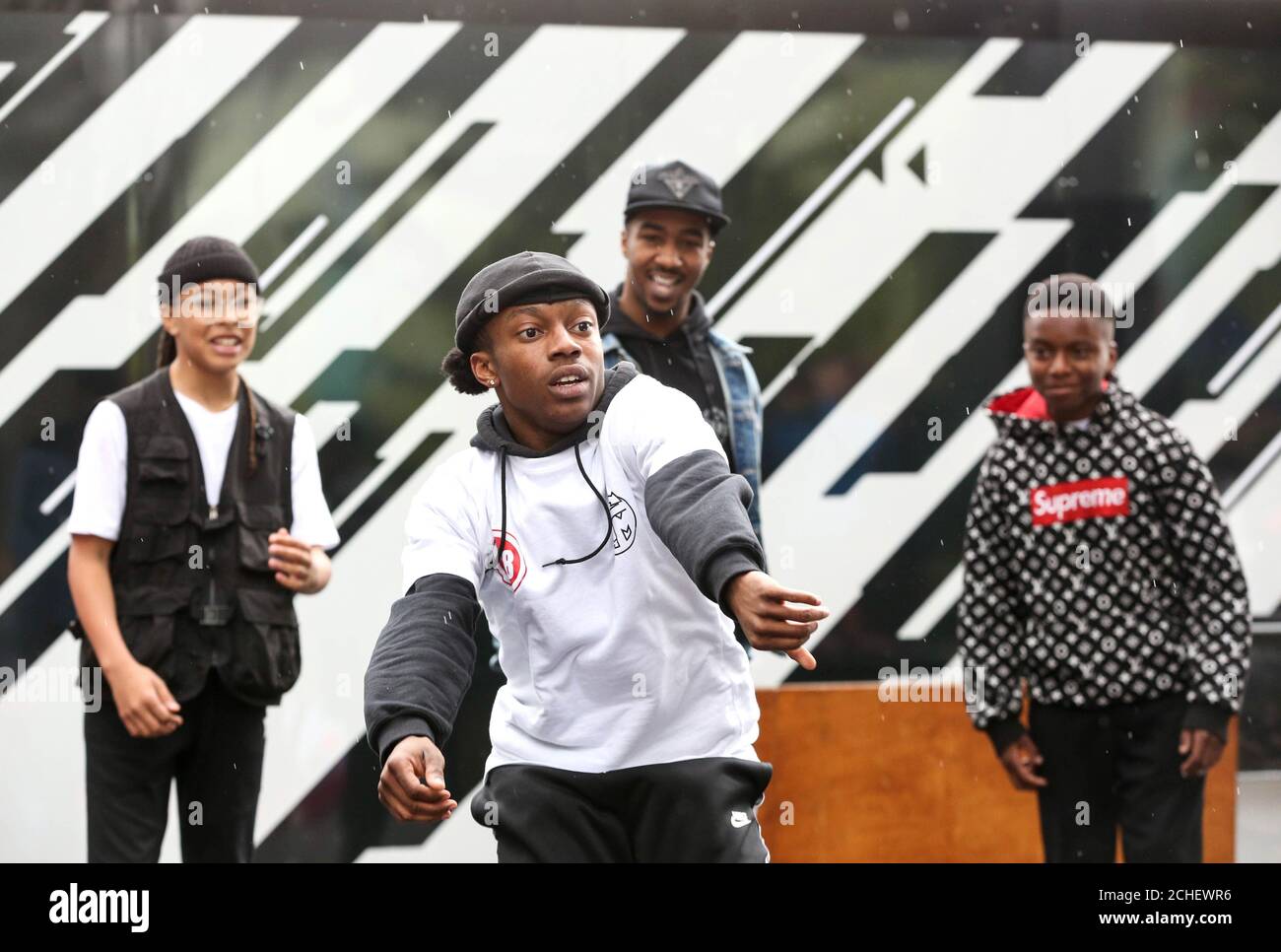 A group of young dance enthusiasts from ÔNew Movementz', presented by East London Dance battle it out on the street as part of ÔYour Stratford Stage' in the International Quarter London. Stock Photo