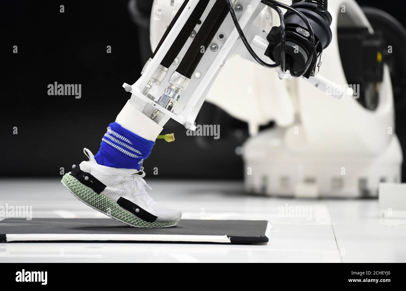 The Adidas shoe Alphaedge with a Elastomer mid-sole from a 3D printer is  tested by a robot during celebrations for German sports apparel maker Adidas'  70th anniversary at the company's FutureLab in