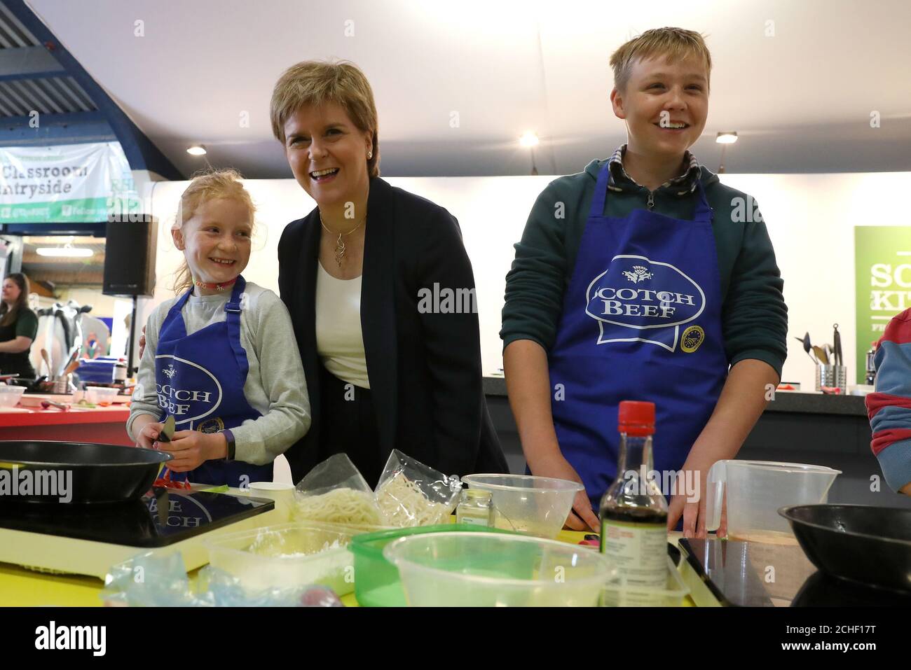 First Minister Nicola Sturgeon with Zara Ross and Fergus Mason at cookery  demonstration at the the Royal Highland Show being held at Ingliston in  Edinburgh Stock Photo - Alamy