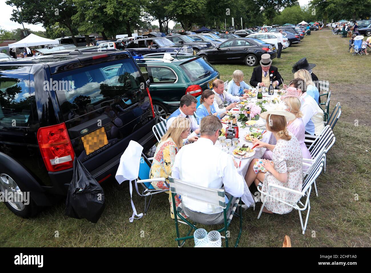Racegoers have a picnic in the car park during day four of Royal Ascot
