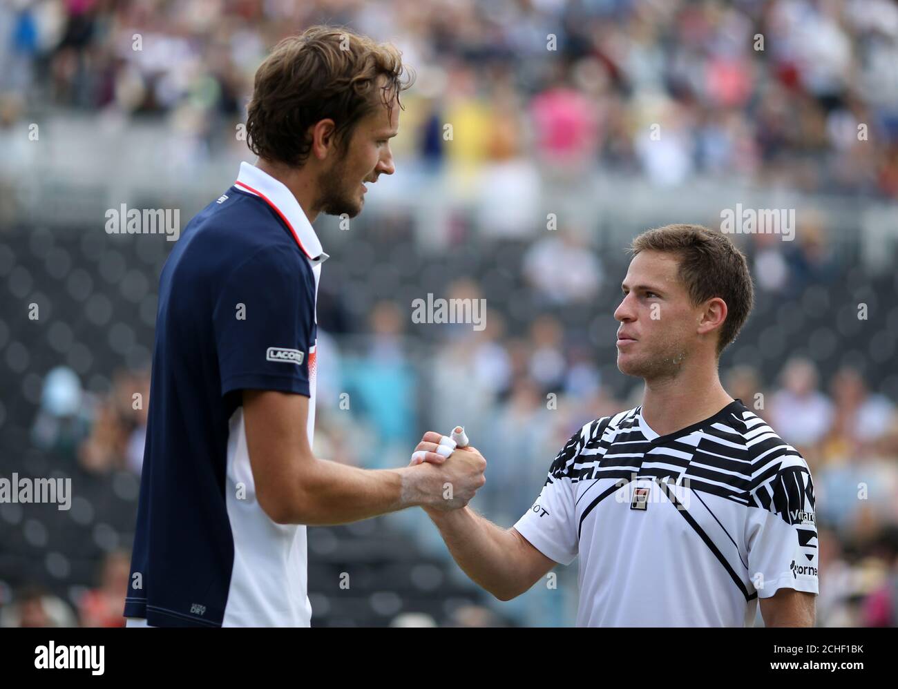 Daniil Medvedev (left) celebrates beating Diego Schwartzman during day five of the Fever-Tree Championship at the Queen's Club, London. Stock Photo