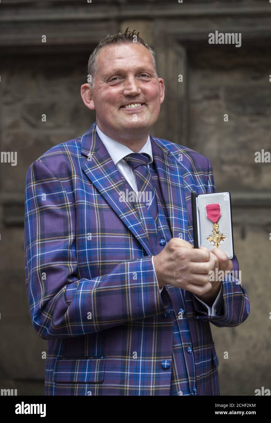 Former Scotland Rugby international and Motor Neurone campaigner Doddie Weir after receiving an OBE from Queen Elizabeth II during an Investiture ceremony at the Palace of Holyroodhouse in Edinburgh. Stock Photo