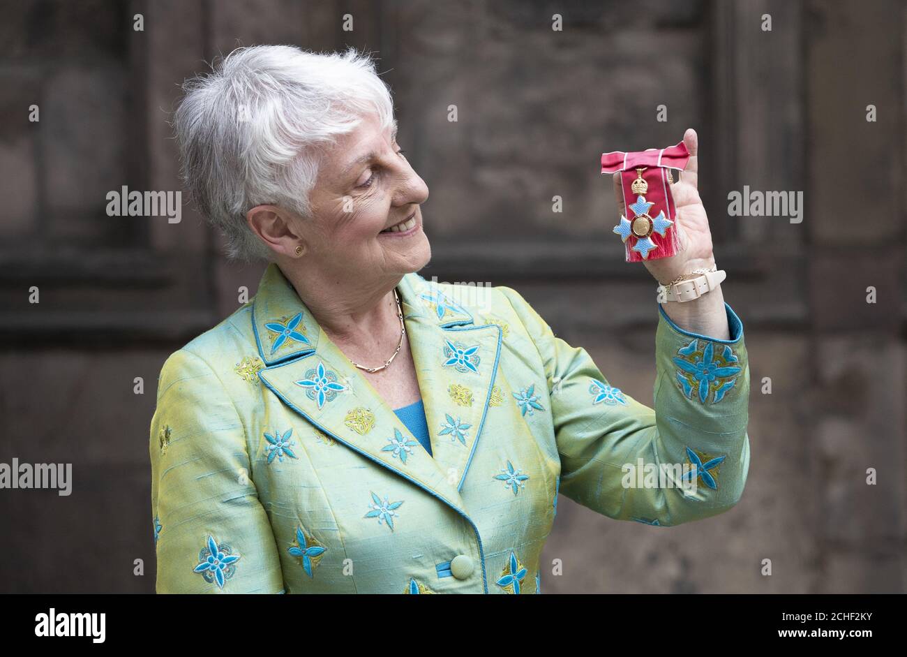 First female moderator of the General Assembly of the Church of Scotland Alison Elliot after receiving her CBE from Queen Elizabeth II during an Investiture ceremony at the Palace of Holyroodhouse in Edinburgh. Stock Photo