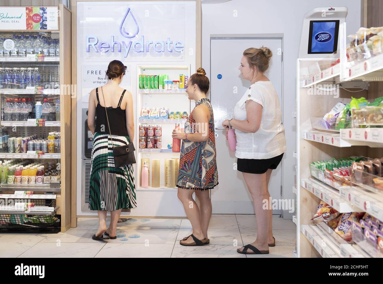 EDITORIAL USE ONLY Customers fill up water bottles at the free