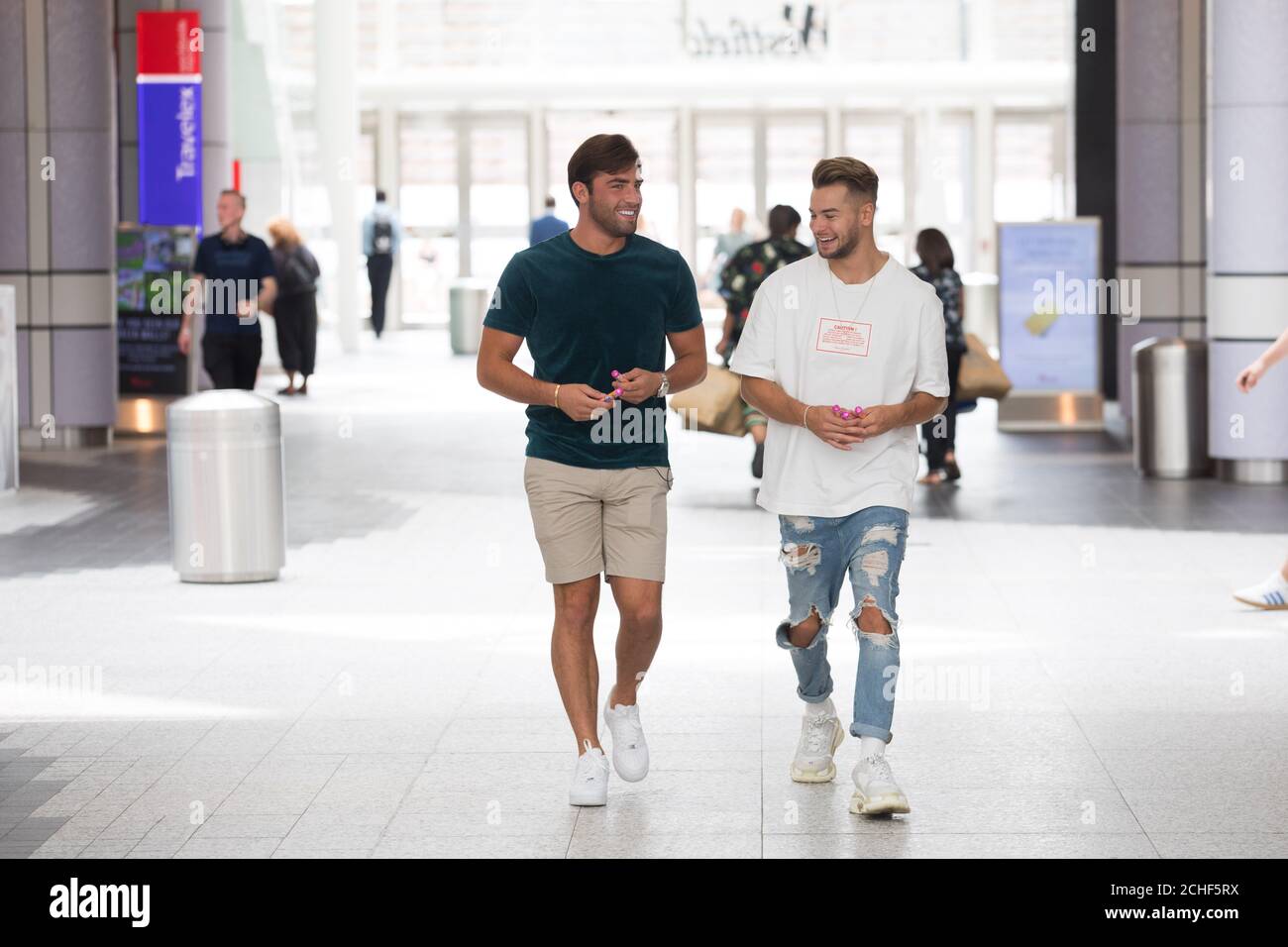Former Love Island contestants Chris Hughes and Jack Fincham compliment each other at Westfield London in association with Mentos to celebrate National Friendship Day, which is on Tuesday July 30. Stock Photo