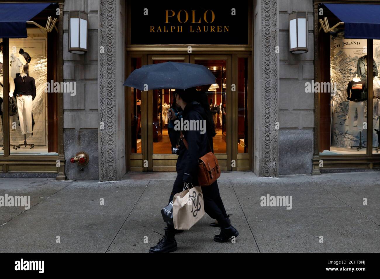 People walk past Ralph Lauren Corp.'s flagship Polo store on Fifth Avenue  in New York City, U.S., April 4, 2017. REUTERS/Brendan McDermid Stock Photo  - Alamy