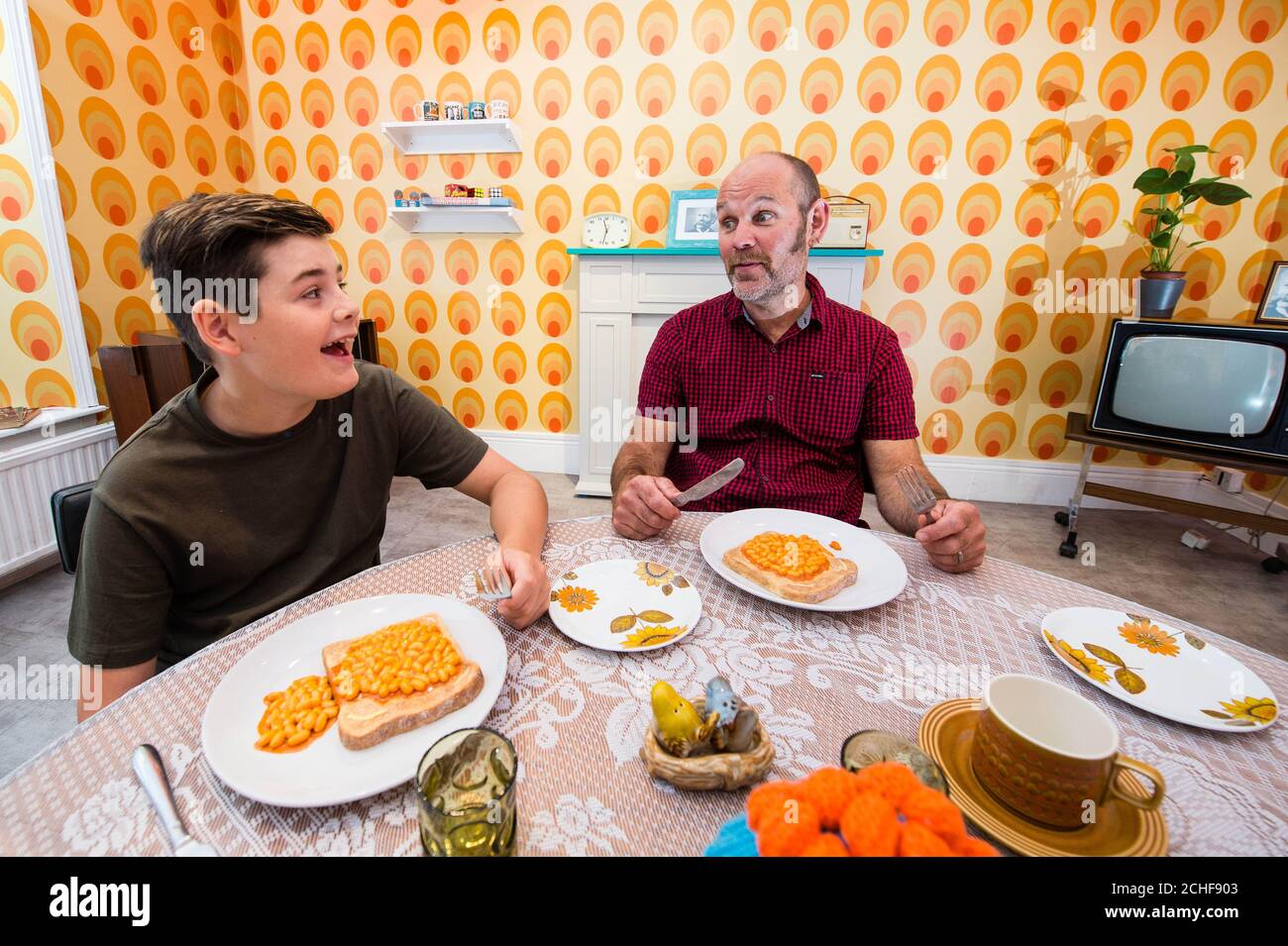 Dylan Fenton, aged 13, and Ali Fenton from Barnstable, visit the 'Heinz Beanz Muzeum', which is open from Friday August 30th to Sunday September 1st at White Space gallery in Covent Garden, London. Stock Photo