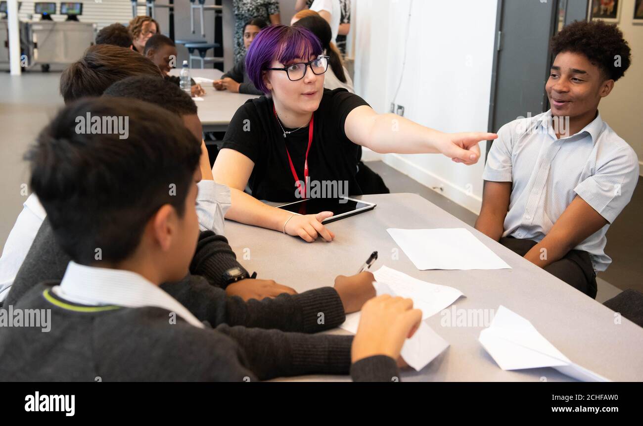 EDITORIAL USE ONLY Students and teachers from the Archer Academy in