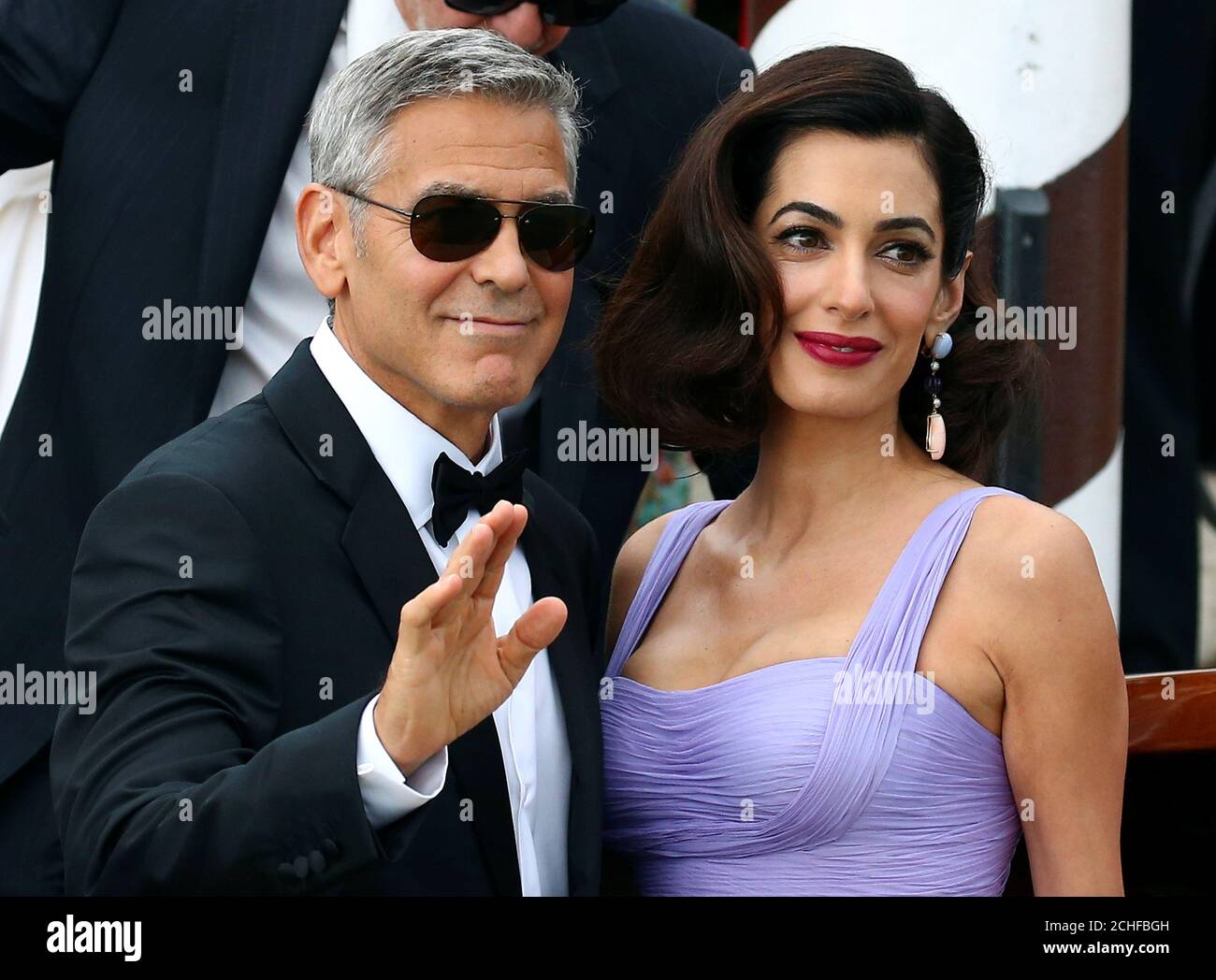 Actor And Director George Clooney Waves Next To His Wife Amal As They Leave The Hotel Before The Red Carpet For The Movie Suburbicon At The 74th Venice Film Festival In Venice Actor And Director George Clooney Waves Next To His Wife Amal As They Leave The Hotel Before The Red Carpet For The Movie Suburbicon At The 74th Venice Film Festival In Venice
