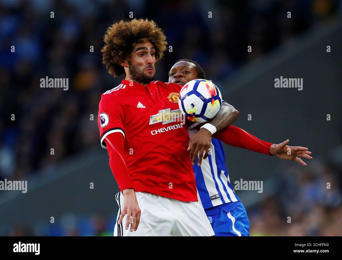 Soccer Football - Premier League - Brighton & Hove Albion v Manchester United - The American Express Community Stadium, Brighton, Britain - May 4, 2018   Manchester United's Marouane Fellaini in action with Brighton's Gaetan Bong   REUTERS/Eddie Keogh    EDITORIAL USE ONLY. No use with unauthorized audio, video, data, fixture lists, club/league logos or 'live' services. Online in-match use limited to 75 images, no video emulation. No use in betting, games or single club/league/player publications.  Please contact your account representative for further details. Stock Photo