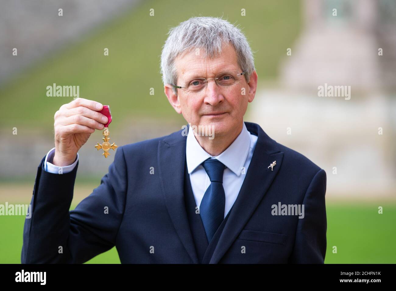 Dr James Beveridge with the OBE he received from Queen Elizabeth II at ...
