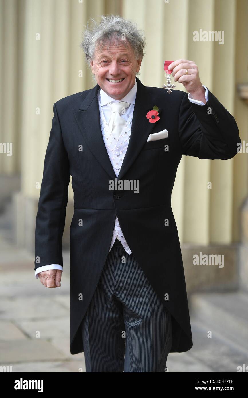 Nicholas Sanders with his MBE medal presented by the Prince of Wales