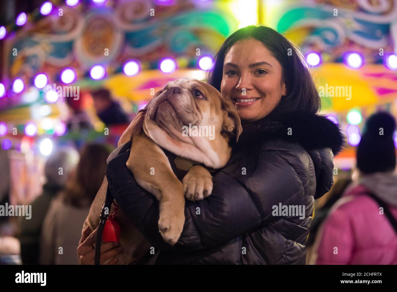 EDITORIAL USE ONLY Laura Armstrong with her dog Alfie at the switch on of  the Marylebone Village Christmas lights on Marylebone High Street, London,  in aid of cancer care and support charity,