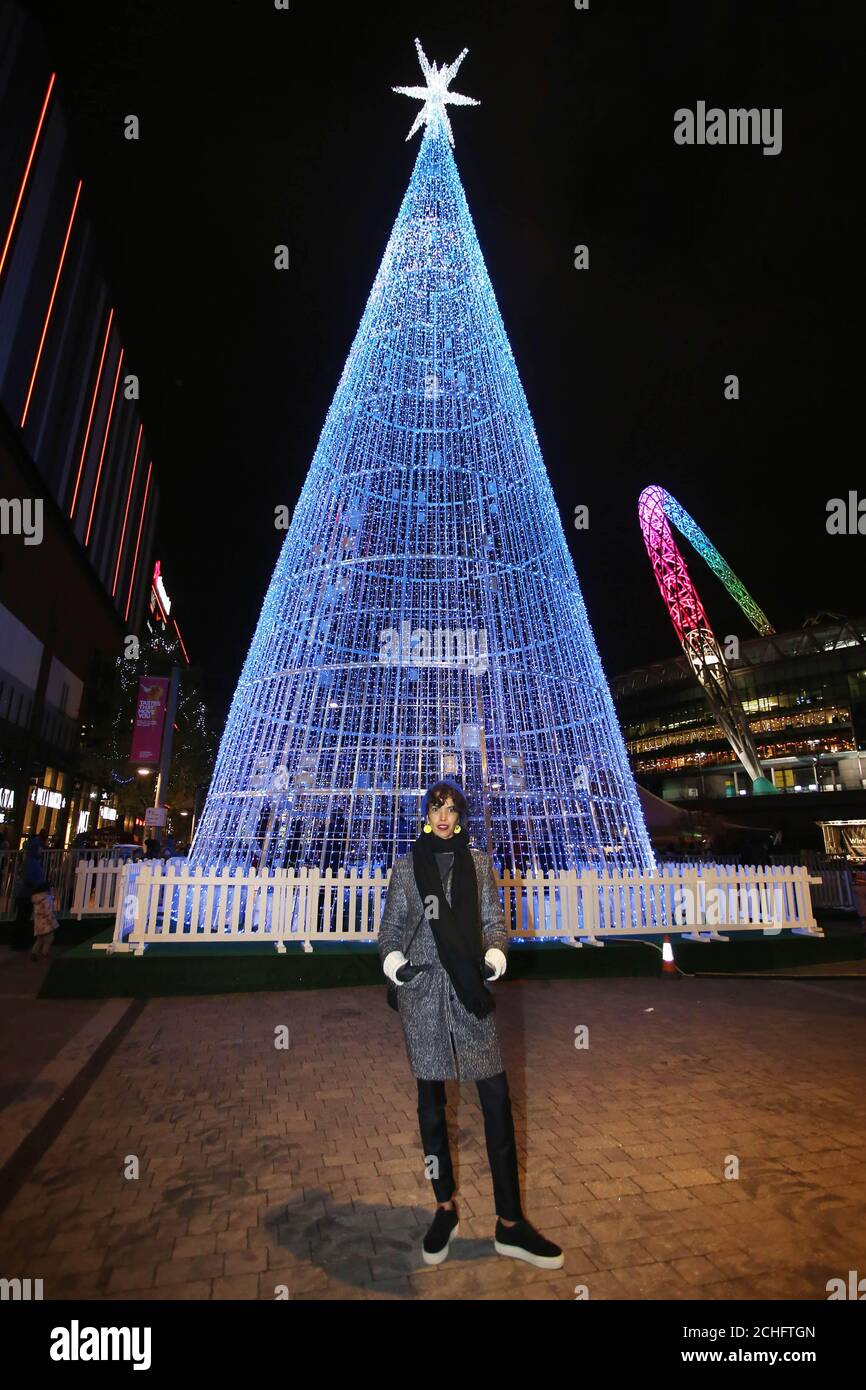 Architectural designer Elyne Legarnisson unveils 'The Hopeful Tree', which is the tallest LED Christmas tree ever built in London and features her installation 'Murmuration of Hopes' at the launch of Wembley Park???s 'Winterfest' Festival in London. PA Photo. Picture date: Wednesday November 20, 2019. The free winter light festival features specially commissioned, site responsive installations including, ???Sonic Runway???, a multisensory corridor which made its European debut at Wembley Park after appearing at Nevada's Burning Man festival. Photo credit should read: Lia To Stock Photo