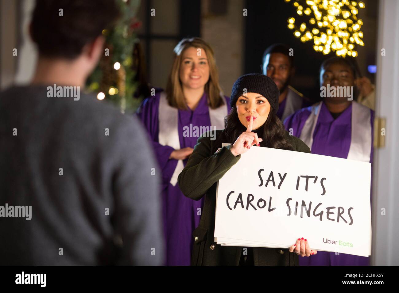 Martine McCutcheon joins Christmas carollers to launch a sweet treat giveaway by online food delivery service Uber Eats in partnership with Tinseltown. PA Photo: Issue date: Tuesday December 3, 2019. Lucky customers will receive from the Tinseltown restaurant a Banoffee pie or chocolate biscuits via the online food delivery service in London on December 6th and Birmingham on December 9th. Photo credit should read: David Parry/PA Wire Stock Photo