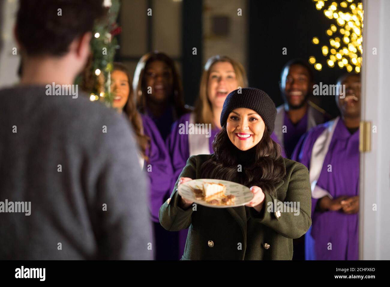EDITORIAL USE ONLY Martine McCutcheon joins Christmas carollers to launch a sweet treat giveaway by online food delivery service Uber Eats in partnership with Tinseltown. PA Photo: Issue date: Tuesday December 3, 2019. Lucky customers will receive from the Tinseltown restaurant a Banoffee pie or chocolate biscuits via the online food delivery service in London on December 6th and Birmingham on December 9th. Photo credit should read: David Parry/PA Wire Stock Photo