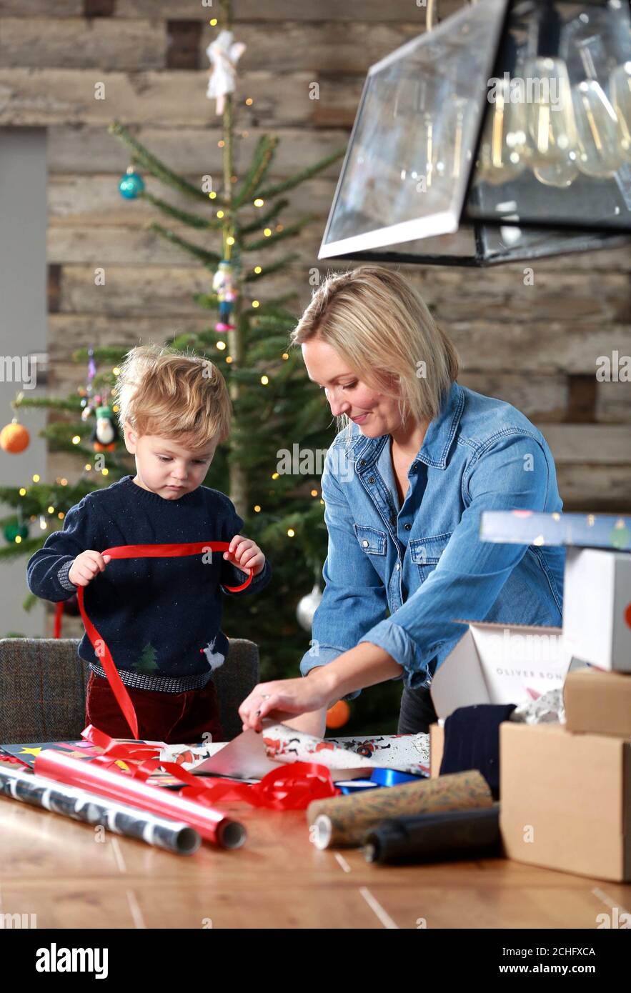 EDITORIAL USE ONLY Hayley Dawson and her son Jack, age 2, unbox their Christmas purchases ready to gift to family and friends, as FTSE 100 packaging company DS Smith reports its half-year results today, revealing a record run-up to this year???s festive season with e-commerce orders on sustainable cardboard and paper boxes up by almost half on last year. Stock Photo