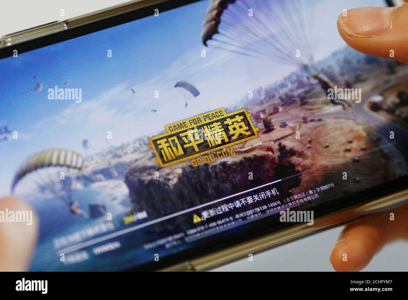 'Game for Peace', Tencent's alternative to the blockbuster video game 'PlayerUnknown's Battlegrounds' (PUBG) in China, is seen on a mobile phone in this illustration picture taken May 13, 2019.  REUTERS/Florence Lo/Illustration Stock Photo