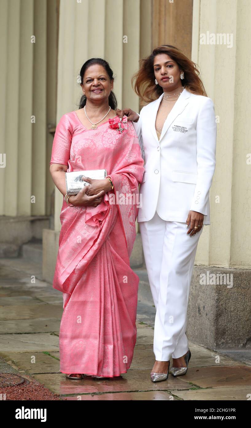 Rapper and singer MIA - real name Mathangi Arulpragasam - with her mother  Kala Pragasam following an investiture ceremony at Buckingham Palace,  London Stock Photo - Alamy