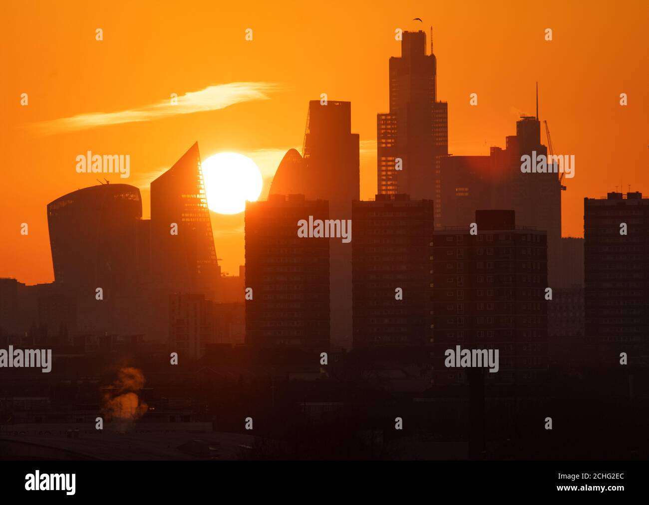 The sun sets behind skyscrapers in the city financial district of London. PA Photo. Picture date: Tuesday January 21, 2020. Photo credit should read: Dominic Lipinski/PA Wire Stock Photo
