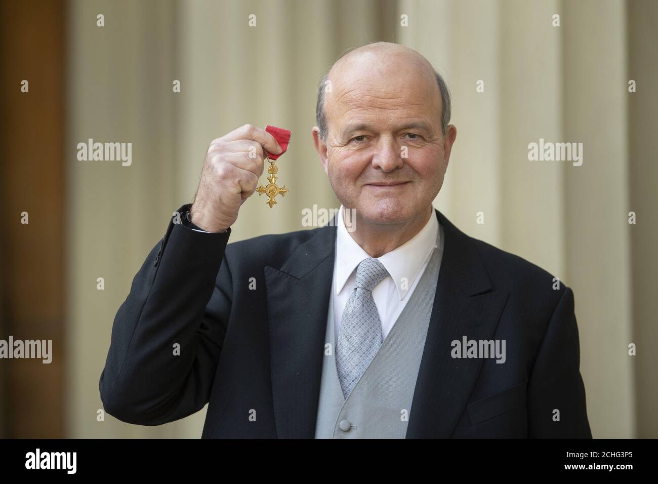 Julian Clyde-Smith with his OBE for services to charity and the legal profession following an investiture ceremony at Buckingham Palace, London. PA Photo. Picture date: Wednesday February 5, 2020. See PA story ROYAL Investiture. Photo credit should read: Victoria Jones/PA Wire Stock Photo