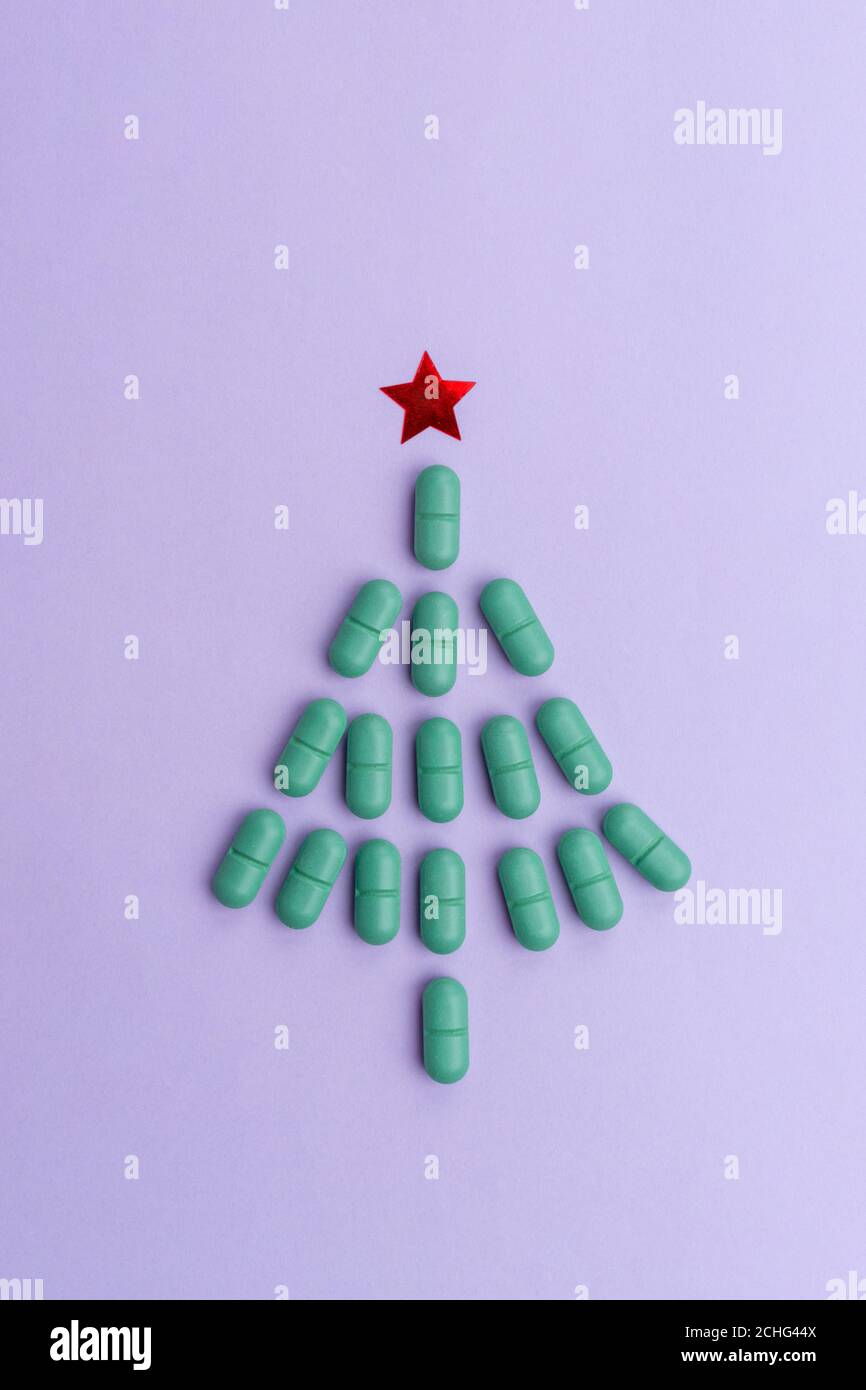 Christmas tree made of pills for Christmas, conceptual background on the New Year theme for