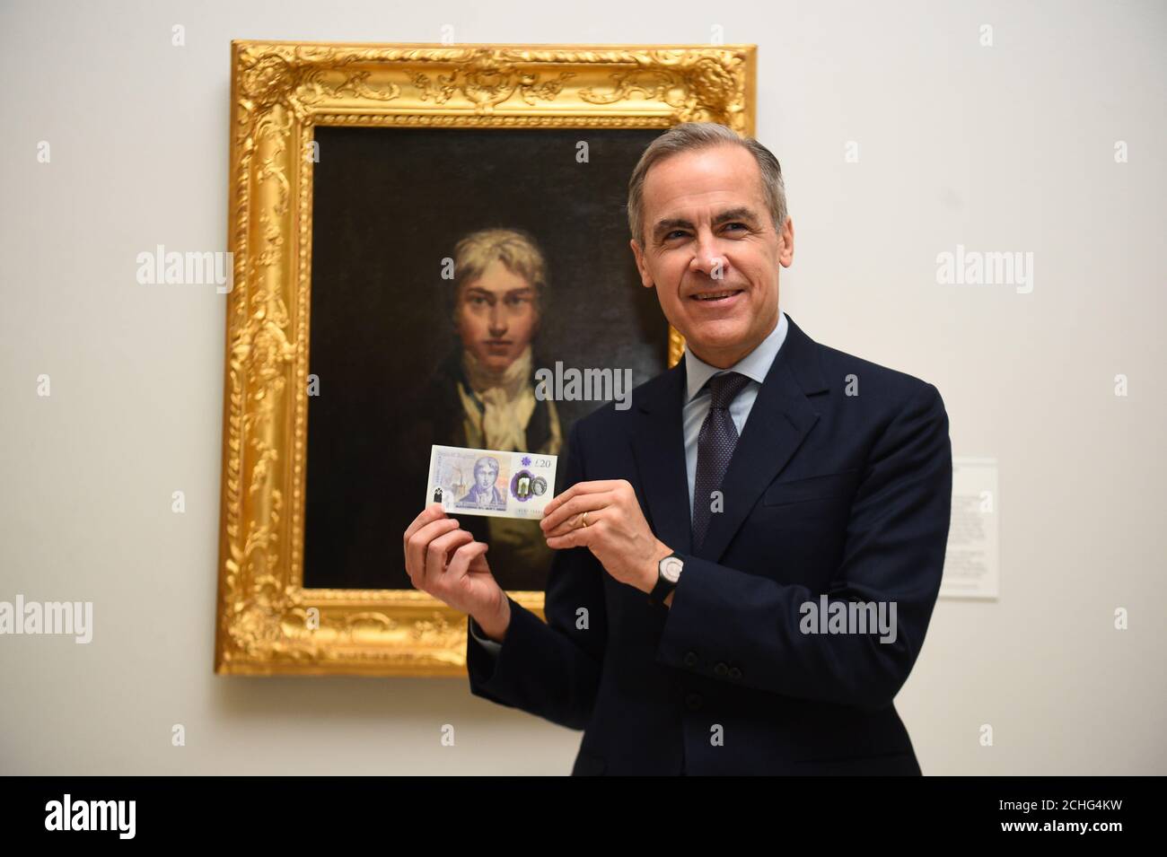 The Governor of the Bank of England Mark Carney with the new £20 note ...