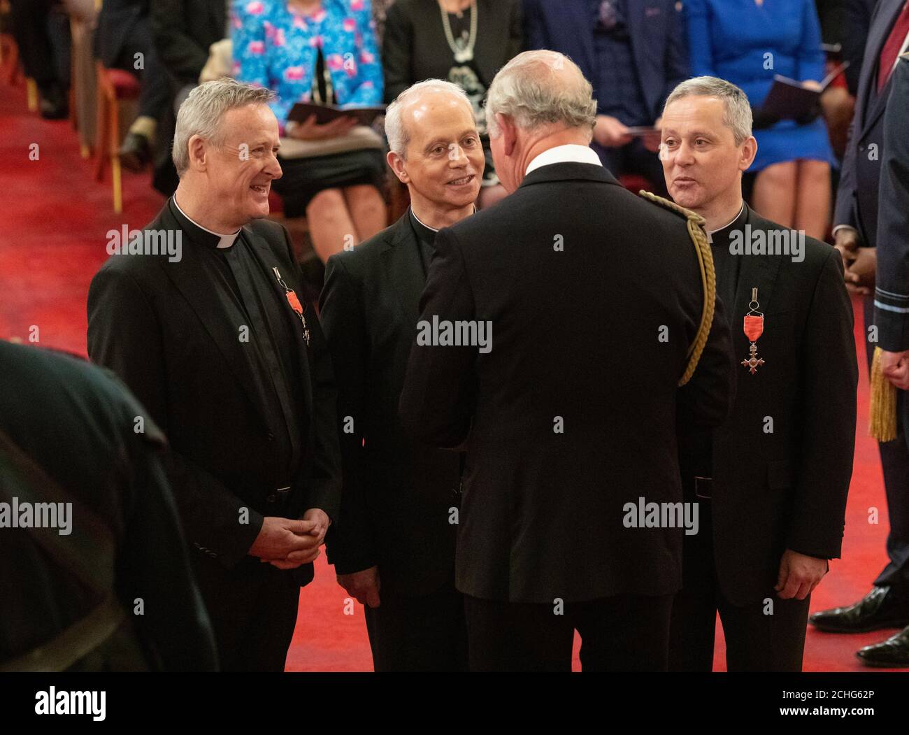 Classical music group the Priests, the Very Reverend David Delargy, the Reverend Eugene O'Hagan and the Reverend Martin O'Hagan are given their MBE (Member of the Order of the British Empire) medals by the Prince of Wales during an investiture ceremony at Buckingham Palace in London. Picture date: Thursday March 5, 2020. See PA story ROYAL Investiture. Photo credit should read: Dominic Lipinski/PA Wire Stock Photo