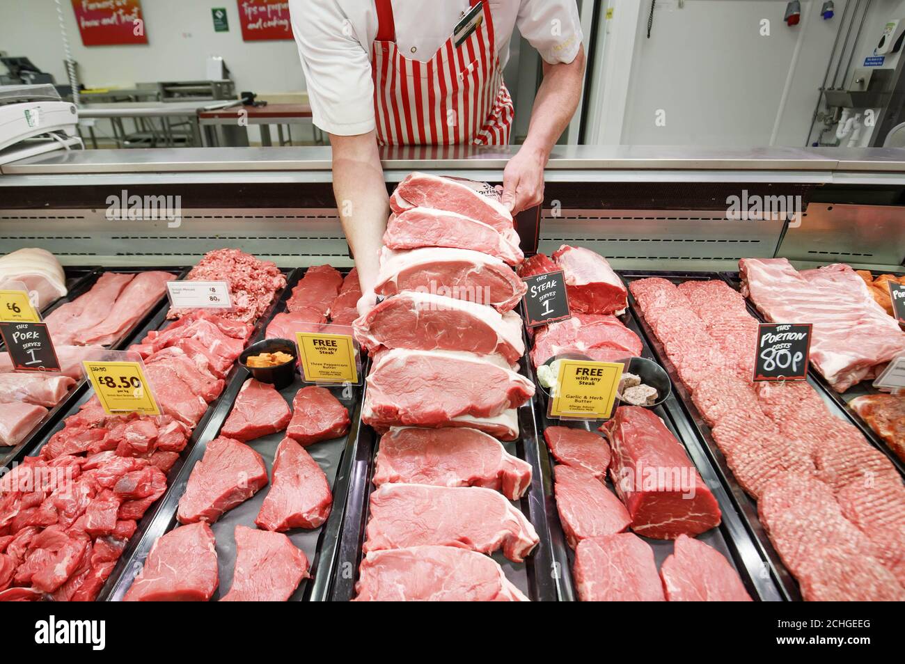 EDITORIAL USE ONLY Morrisons' Butcher Nick Verity prepares sirloin