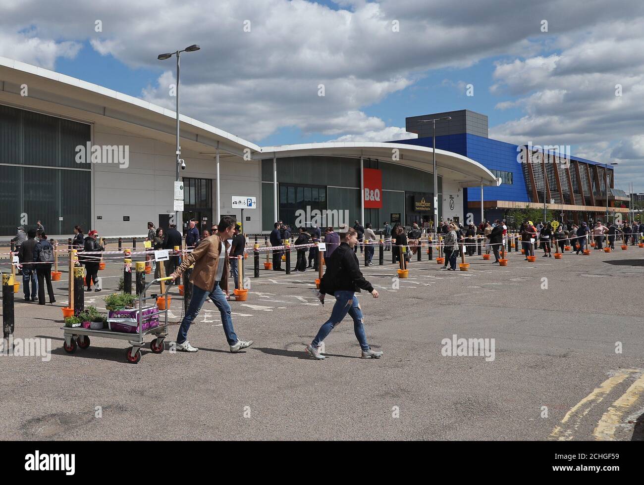 People queuing outside the B&Q Greenwich store, London Stock Photo Alamy
