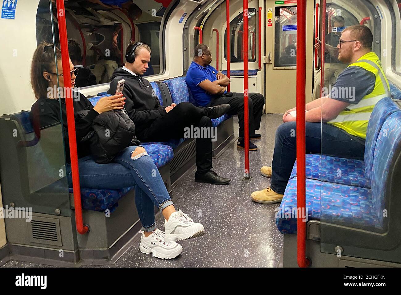 Members of the public ignore social distancing measures on the Central Line as the UK continues in lockdown to help curb the spread of the coronavirus. Stock Photo