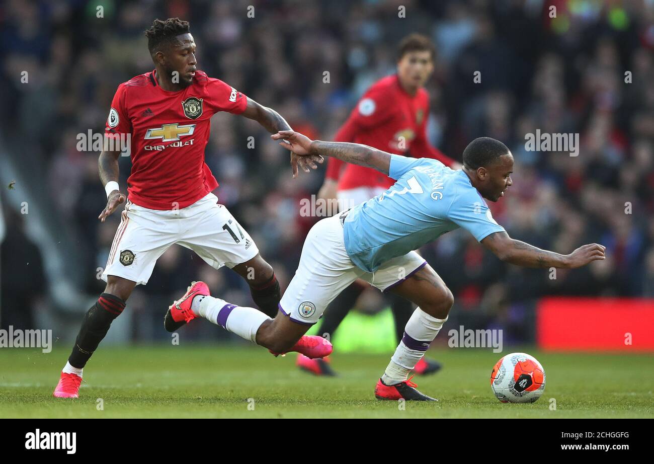 Manchester City's Raheem Sterling battles to hold off challenge for the ball from Manchester United's Fred during the Premier League match at Old Trafford, Manchester. Stock Photo