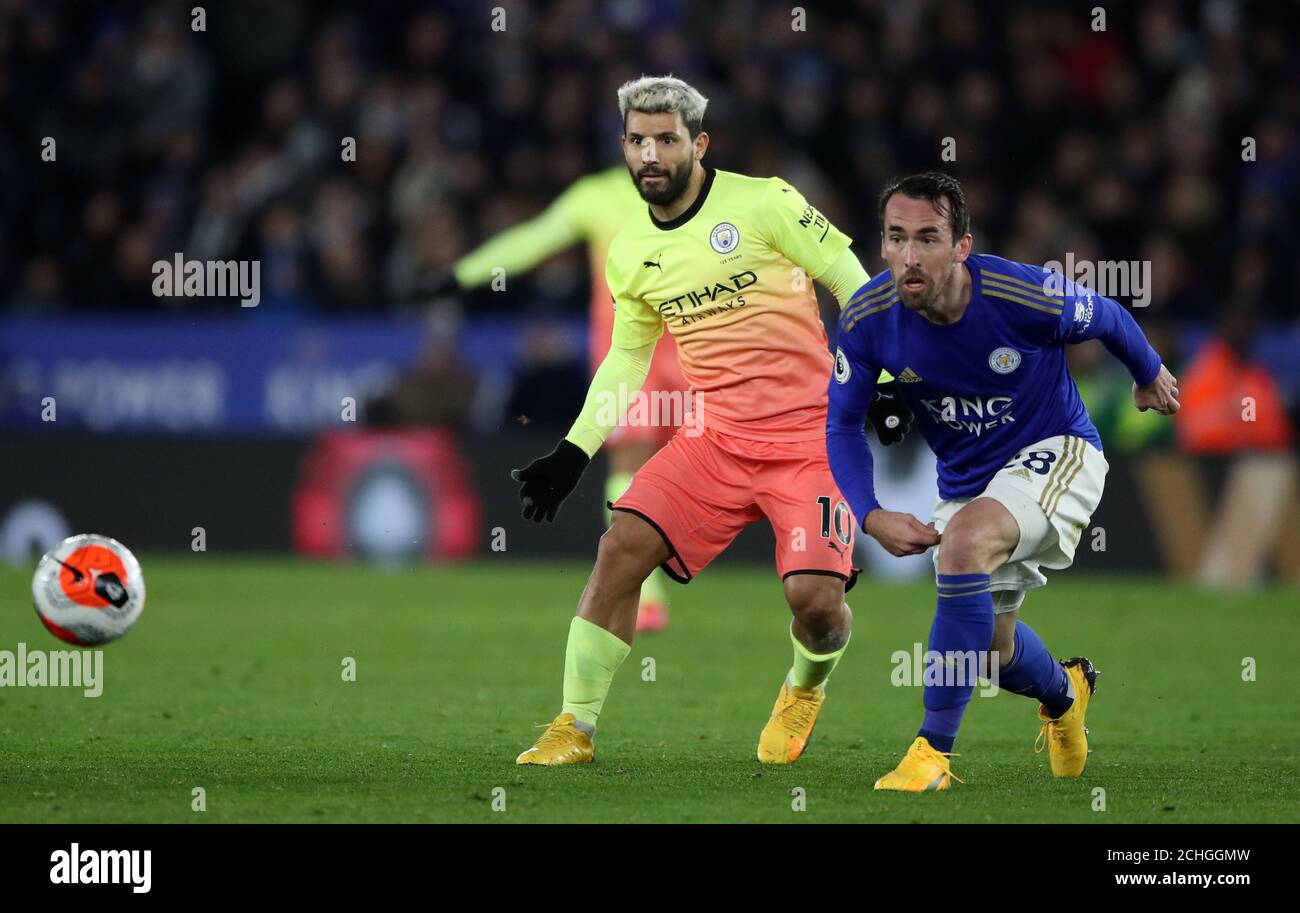 Manchester City's Sergio Aguero moves ball around Leicester City's Christian Fuchs during the Premier League match at the King Power Stadium, Leicester. Stock Photo